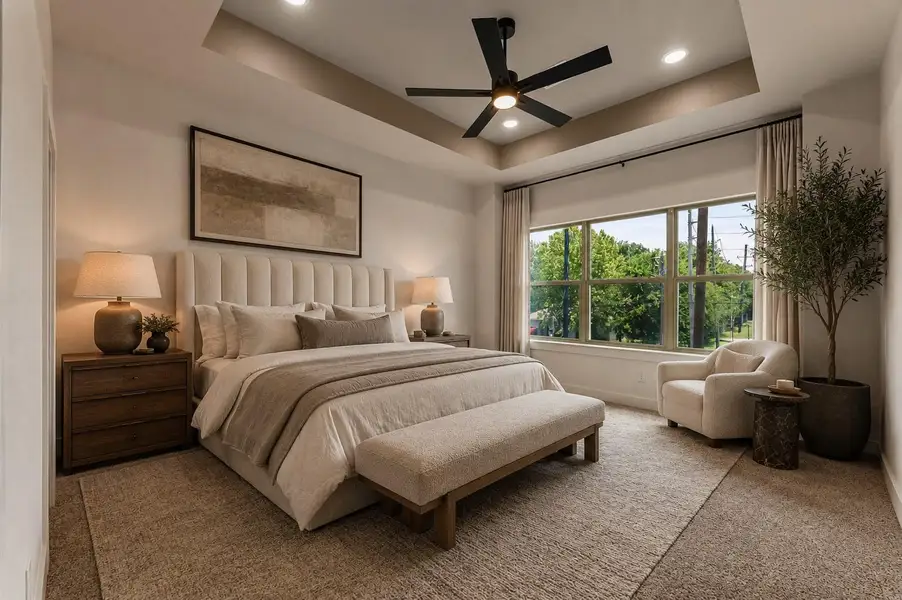 Private primary retreat featuring recessed ceiling detail, oversized windows, and a calm, airy atmosphere.