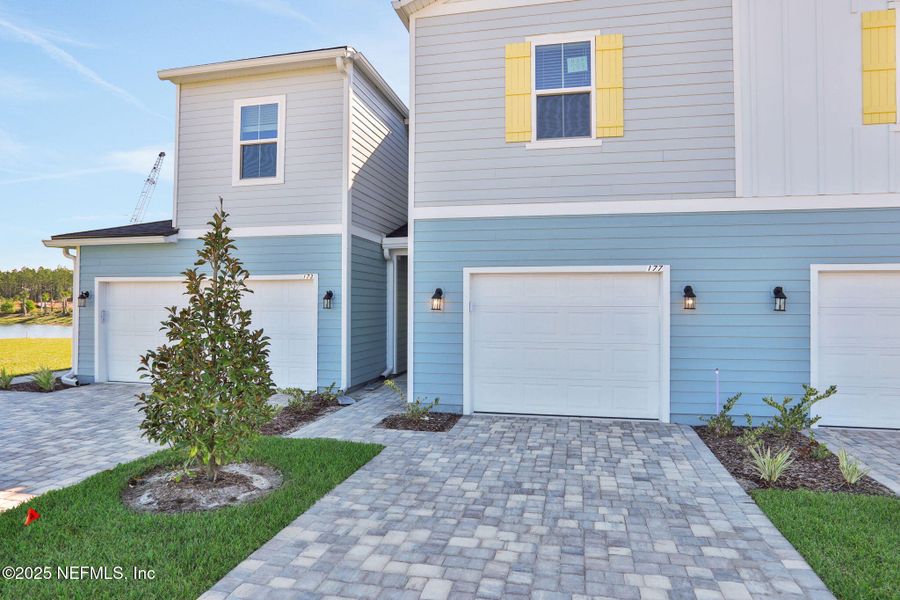 Exterior details and patio area of a home in Brook Forest - Townhomes, St. Augustine (Image 3).