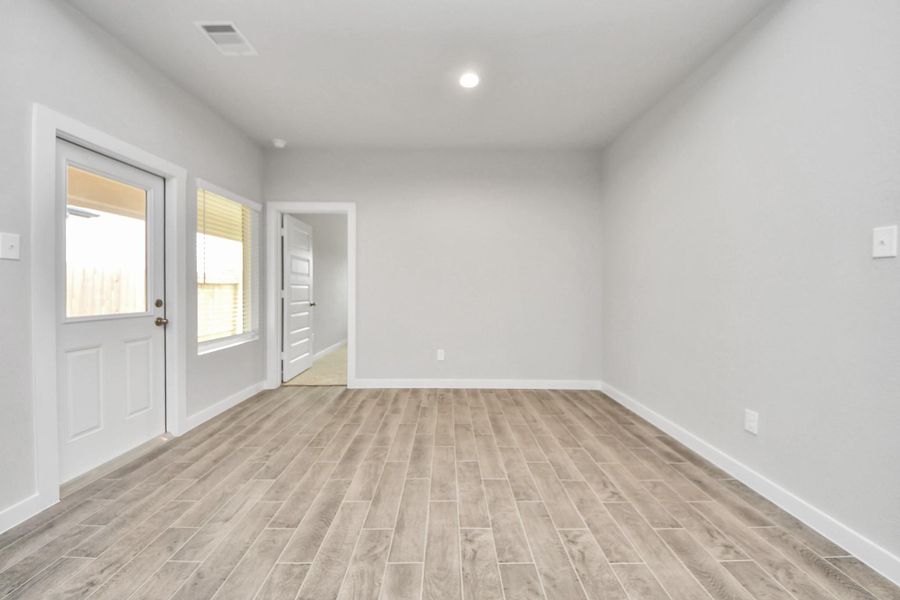 Welcome family and guests to your charming living room! Sample photo of completed home with similar floor plan. Actual colors and selections may vary.