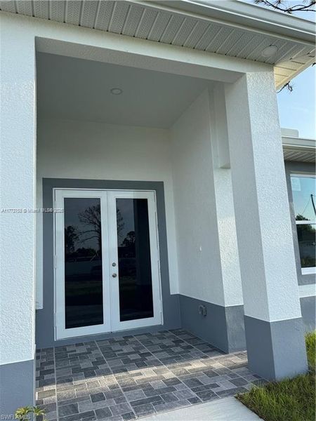 Front exterior of a new home in , Lehigh Acres, FL, highlighting curb appeal (Image 2).