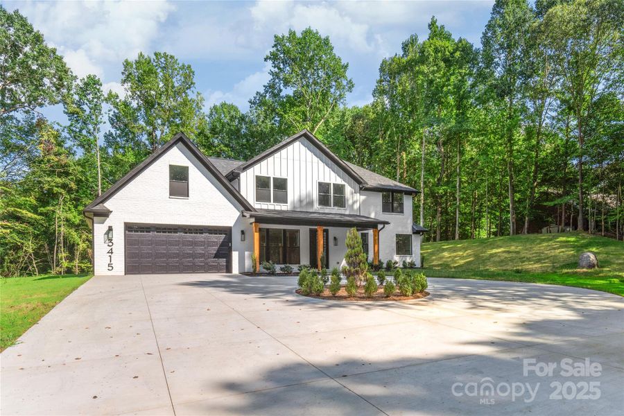 Front exterior of a new home in , Waxhaw, NC, highlighting curb appeal (Image 1). Front exterior of a new home in , Waxhaw, NC, highlighting curb appeal (Image 1).