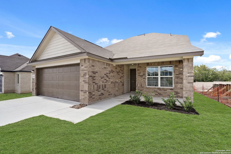 Front exterior of a new home in Hunters Ranch, San Antonio, TX, highlighting curb appeal (Image 23).