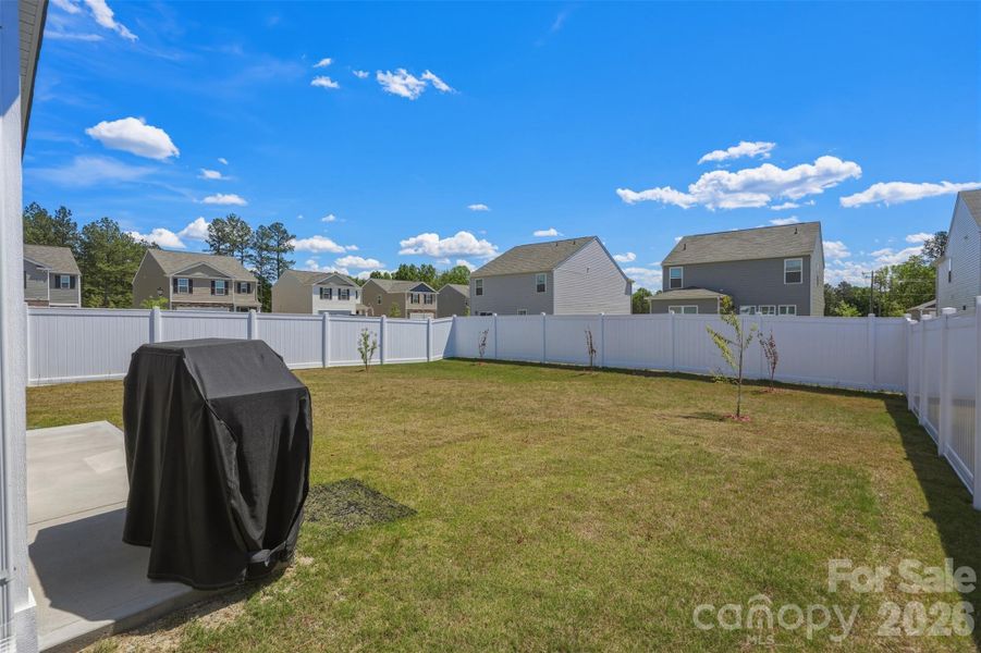 backyard- screened-in porch, extended cement patio, vinyl privacy fence- upgrade added after purchase!