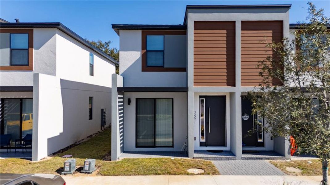Front exterior of a new home in , Kissimmee, FL, highlighting curb appeal (Image 1). Front exterior of a new home in , Kissimmee, FL, highlighting curb appeal (Image 1).