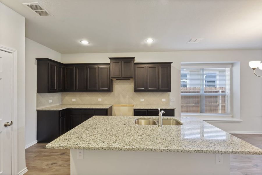 Representative exterior photo of a completed home built from the Cameron by Impression Homes in Heartland, Heartland, TX (Image 6).