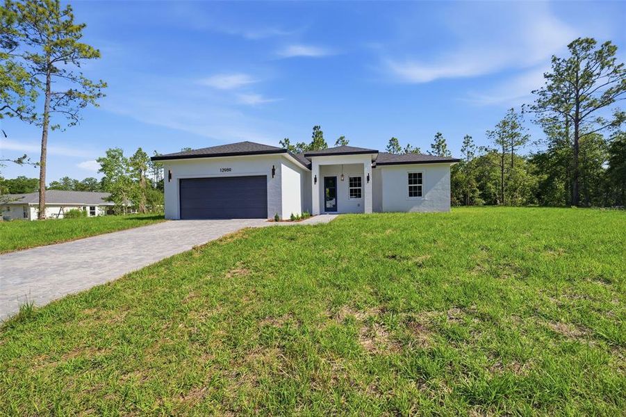 Front exterior of a new home in , Ocala, FL, highlighting curb appeal (Image 20).