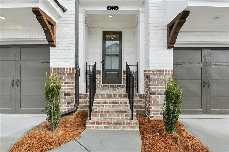 Exterior details and patio area of a home in Millcroft Townhomes, Buford (Image 3). Exterior details and patio area of a home in Millcroft Townhomes, Buford (Image 3).