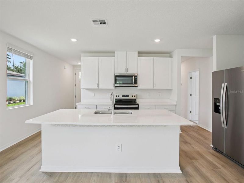 Furnished interior view inside a new home in The Grove at Stuart Crossing - Premier Series, Bartow (Image 9).
