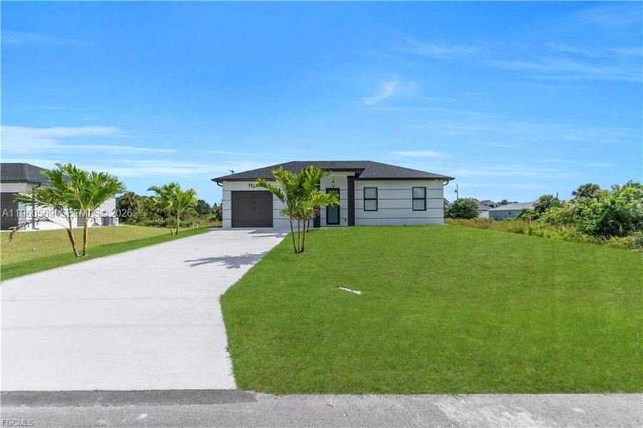 Front exterior of a new home in , Lehigh Acres, FL, highlighting curb appeal (Image 17).