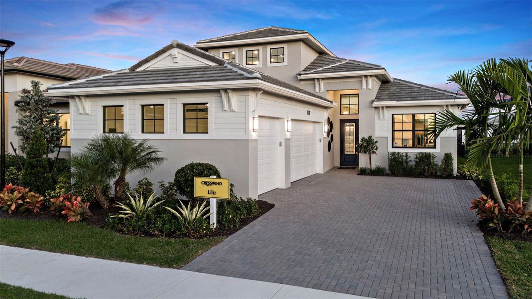 Front exterior of a new home in Cresswind Palm Beach at Westlake, Westlake, FL, highlighting curb appeal (Image 1).