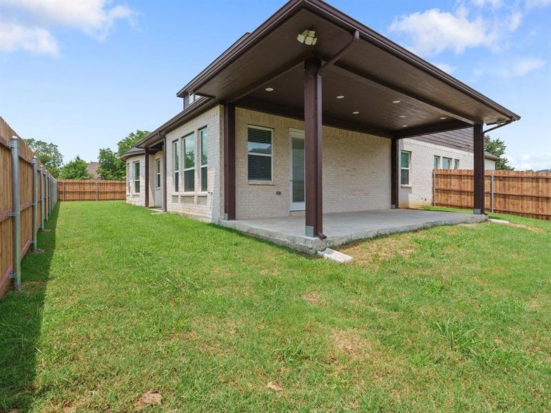 Exterior details and patio area of a home in , Denison (Image 21). Exterior details and patio area of a home in , Denison (Image 21).