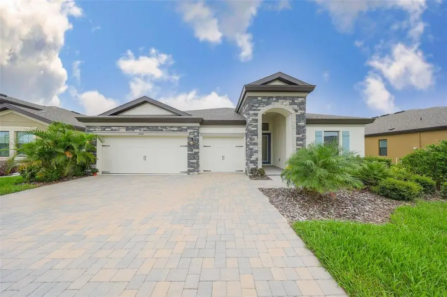 Exterior details and patio area of a home in Triple Creek, Riverview (Image 24).