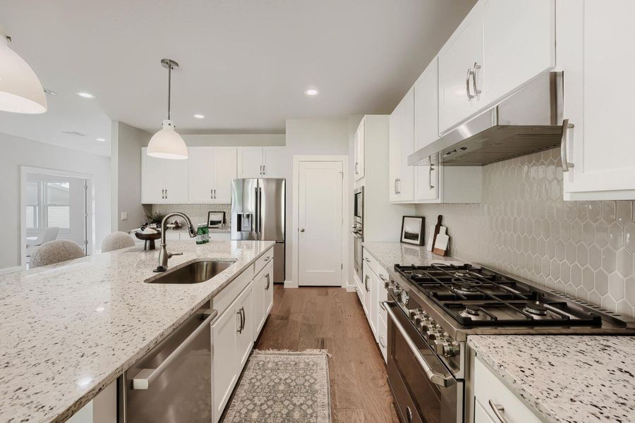 Culinary aspirations find their home in this well-appointed kitchen, featuring abundant counter space and modern appliances. Culinary aspirations find their home in this well-appointed kitchen, featuring abundant counter space and modern appliances.