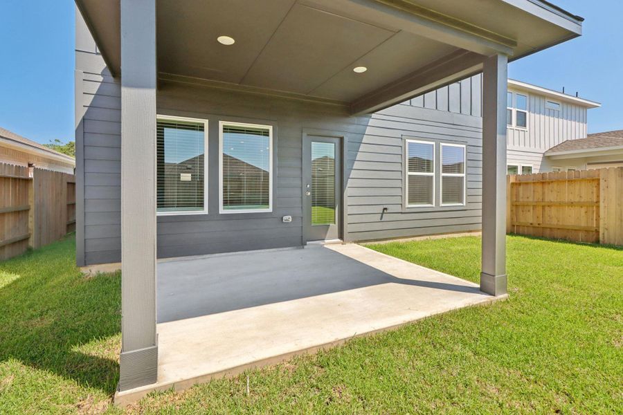 Exterior details and patio area of a home in Landing Meadows - Traditional Series, New Caney (Image 20).