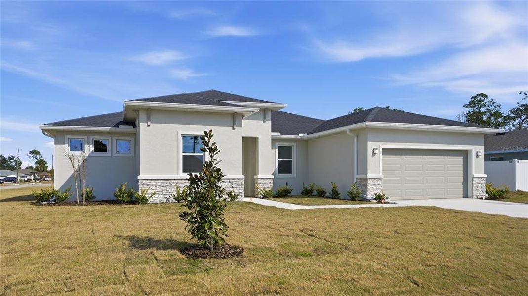 Front exterior of a new home in , Palm Coast, FL, highlighting curb appeal (Image 26).
