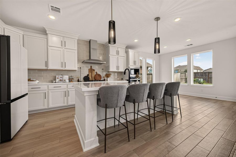 The breakfast bar offers additional seating in this spacious kitchen. The breakfast bar offers additional seating in this spacious kitchen.