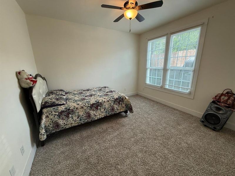 Bedroom featuring carpet floors and a ceiling fan