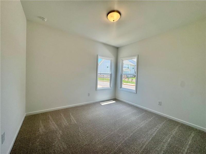 Spacious, unfurnished interior of a new home in Eastlyn Crossing, Flowery Branch (Image 23).