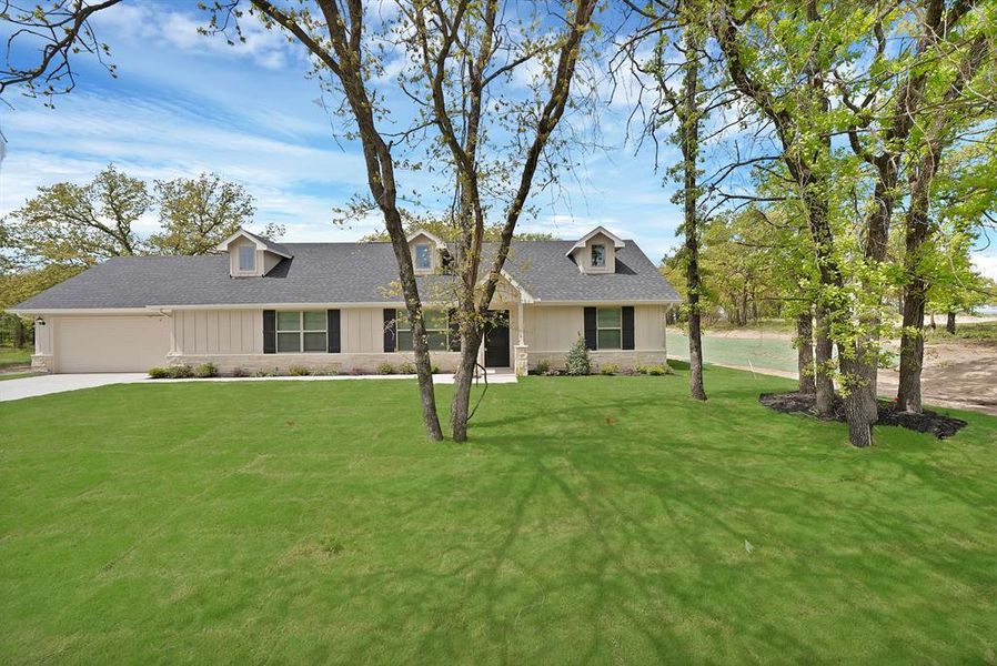 Front exterior of a new home in , Poolville, TX, highlighting curb appeal (Image 18).