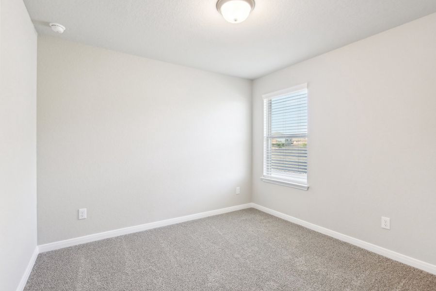 Guest bedroom in the Medina floorplan at a Meritage Homes community.