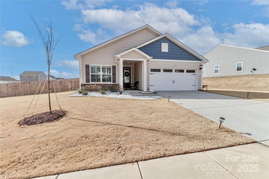 Front exterior of a new home in Colonial Crossing, Troutman, NC, highlighting curb appeal (Image 21). Front exterior of a new home in Colonial Crossing, Troutman, NC, highlighting curb appeal (Image 21).
