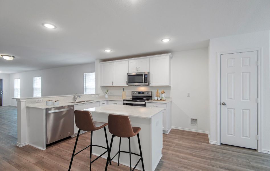 Kitchen featuring a large island ideal for informal dining and gatherings