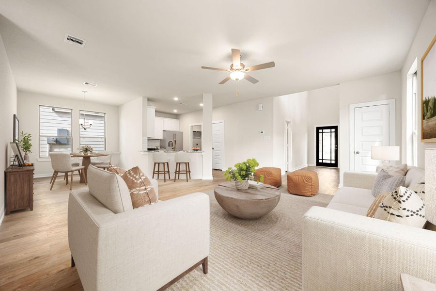 This bright and inviting open-concept living space features expansive windows that fill the room with natural light. The seamless flow between the living, dining, and kitchen areas creates an airy and functional layout. Modern finishes, recessed lighting, and warm wood-look flooring add to the home’s clean and contemporary appeal. This bright and inviting open-concept living space features expansive windows that fill the room with natural light. The seamless flow between the living, dining, and kitchen areas creates an airy and functional layout. Modern finishes, recessed lighting, and warm wood-look flooring add to the home’s clean and contemporary appeal.