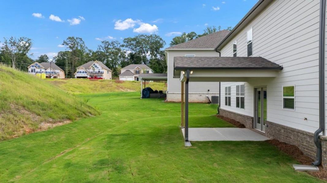 Front exterior of a new home in Butner Estates, College Park, GA, highlighting curb appeal (Image 2).