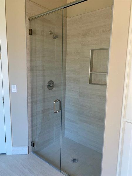 Bathroom with a shower with door