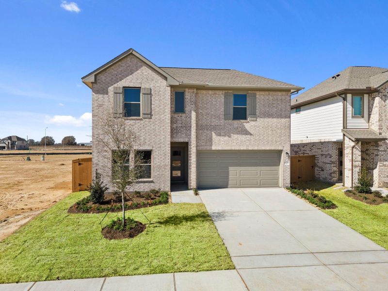 Front exterior of a new home in Cypress Green, Hockley, TX, highlighting curb appeal (Image 2). Front exterior of a new home in Cypress Green, Hockley, TX, highlighting curb appeal (Image 2).
