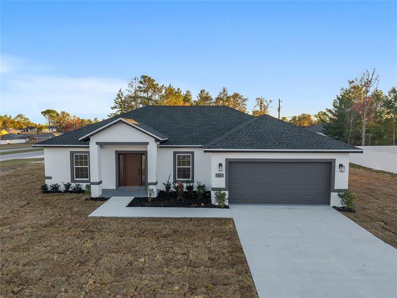 Front exterior of a new home in , Ocala, FL, highlighting curb appeal (Image 26).