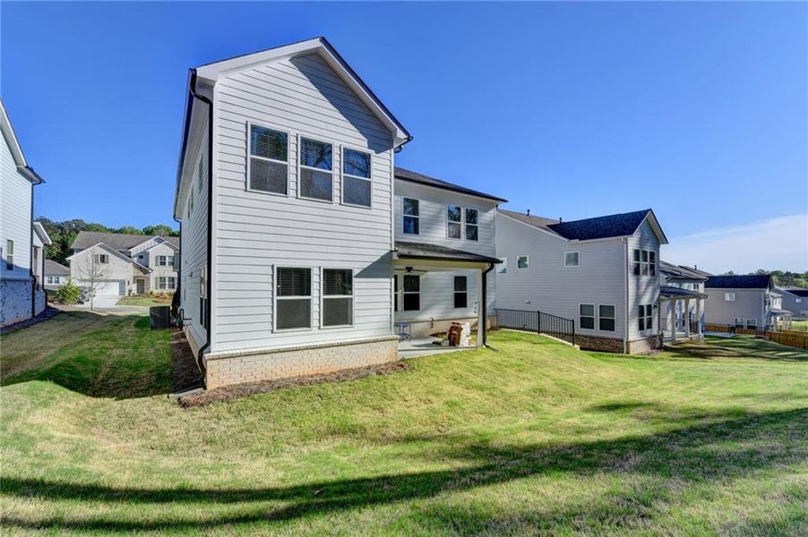 Exterior details and patio area of a home in Bailey Fence, Dacula (Image 29).