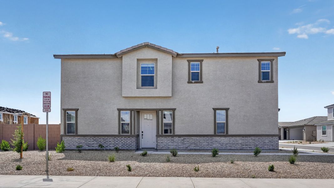 Front exterior of a new home in Artisan at Asante, Surprise, AZ, highlighting curb appeal (Image 2). Front exterior of a new home in Artisan at Asante, Surprise, AZ, highlighting curb appeal (Image 2).