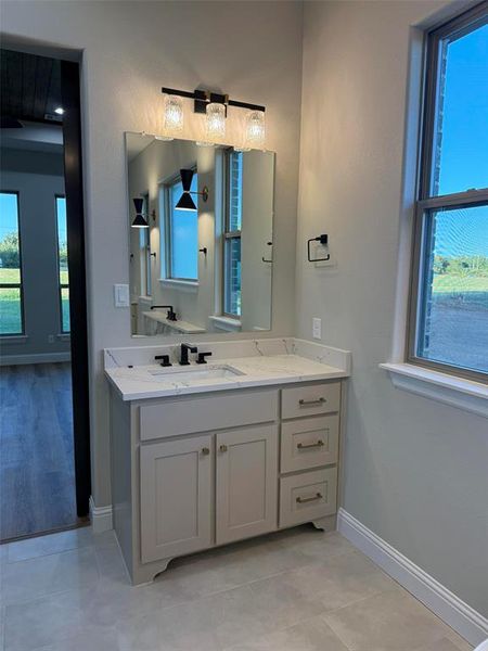 Bathroom with vanity and light tile patterned flooring Bathroom with vanity and light tile patterned flooring