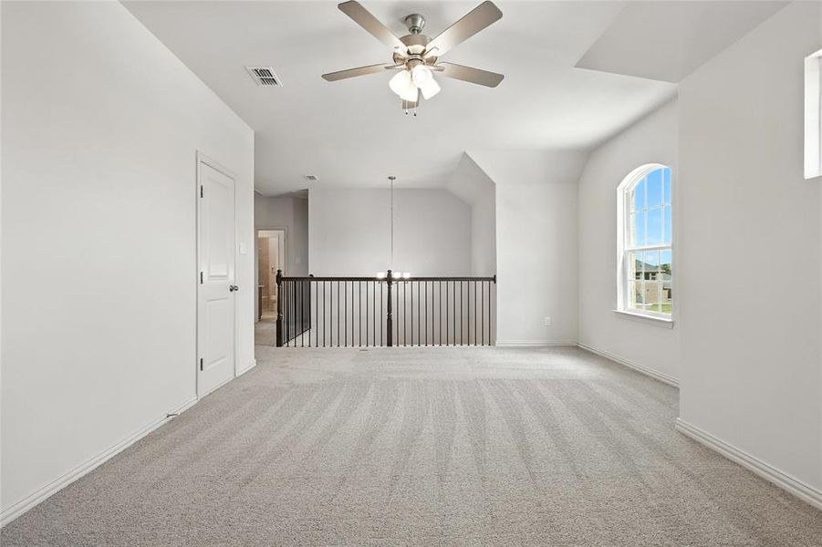 Spare room with a ceiling fan and light carpet Spare room with a ceiling fan and light carpet