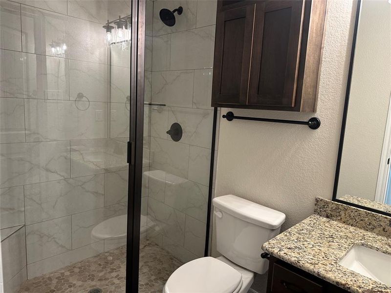 Bathroom with vanity and a stall shower Bathroom with vanity and a stall shower