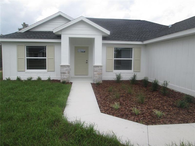 Front exterior of a new home in , Ocala, FL, highlighting curb appeal (Image 38).
