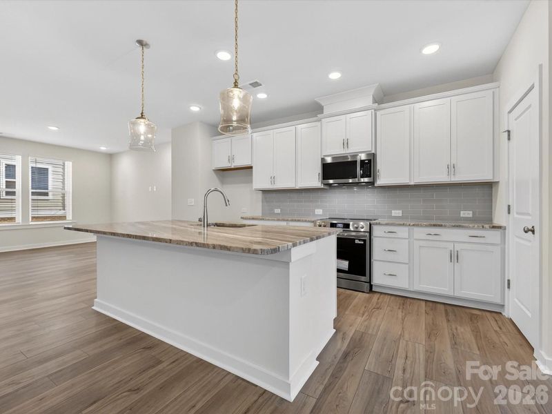 Furnished interior view inside a new home in Central Living at Craig, Charlotte (Image 8).