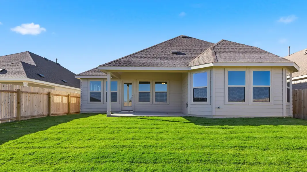 Exterior details and patio area of a home in Carillon, Manor (Image 3).