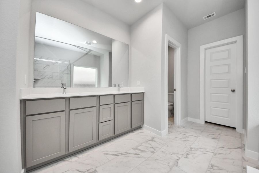 Ascend to relaxation in this fantastic game room! Ideal for both casual gatherings and adult gaming, it boasts plush carpet, lofty ceilings, custom paint, and ample windows for abundant natural light. Sample photo of completed home with similar floor plan. Actual colors and selections may vary.