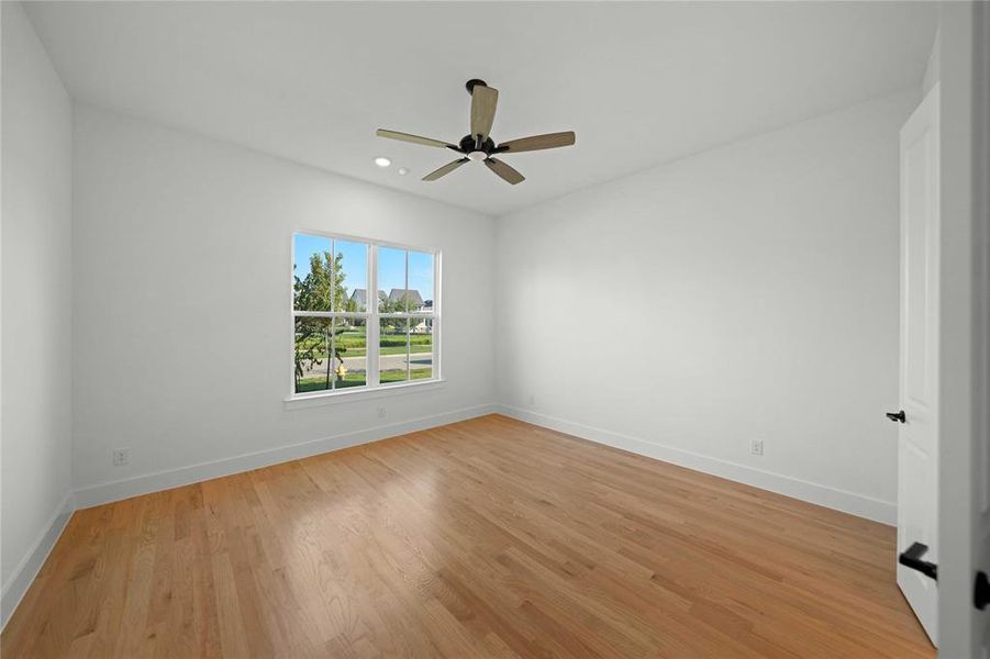 Empty room with light wood-style floors, recessed lighting, and a ceiling fan Empty room with light wood-style floors, recessed lighting, and a ceiling fan