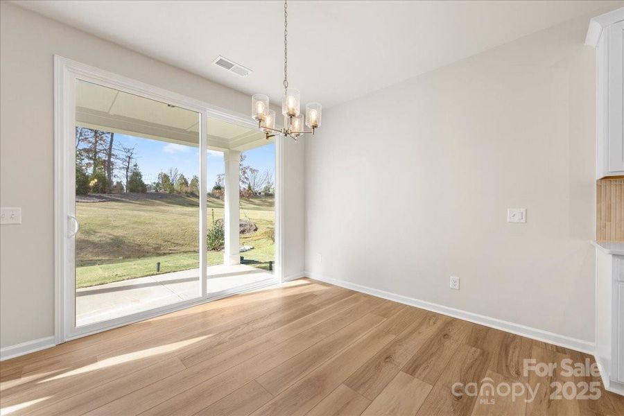 Dining Space Featuring Large Sliding Glass Doors to Outdoor Living.