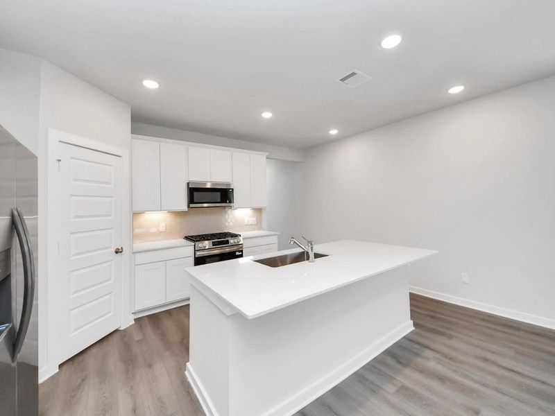 Furnished interior view inside a new home in Caney Creek Place, Conroe (Image 9).