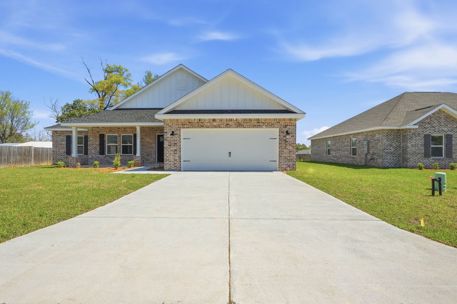 Front exterior of a new home in Barton's Bend, Crestview, FL, highlighting curb appeal (Image 24).