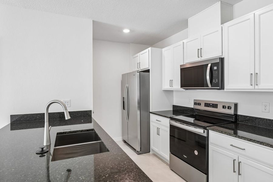 Furnished interior view inside a new home in Reserve at Forest Lake Townhomes, Lake Wales (Image 6).