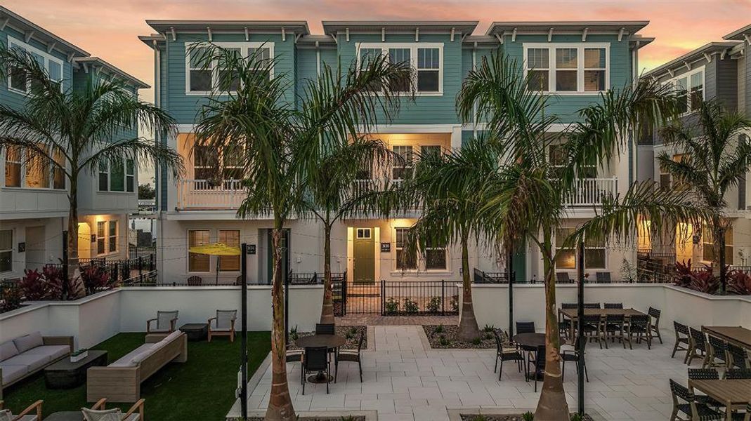 Front exterior of a new home in Towns at Union, St. Petersburg, FL, highlighting curb appeal (Image 2). Front exterior of a new home in Towns at Union, St. Petersburg, FL, highlighting curb appeal (Image 2).