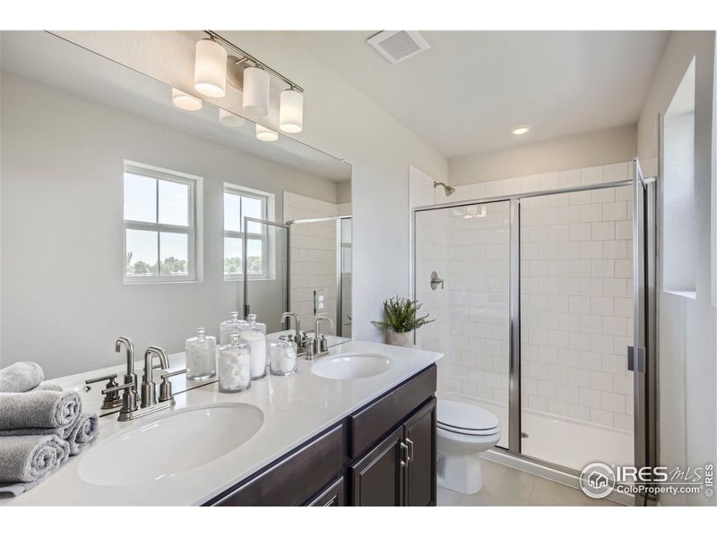 Striking primary bathroom - Same Floor Plan, Different Model.