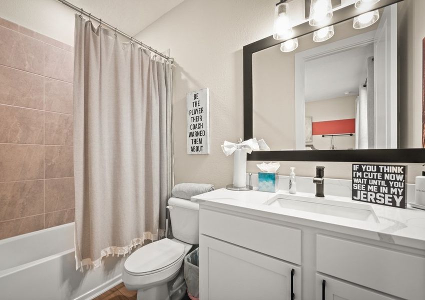Secondary bathroom with vanity.