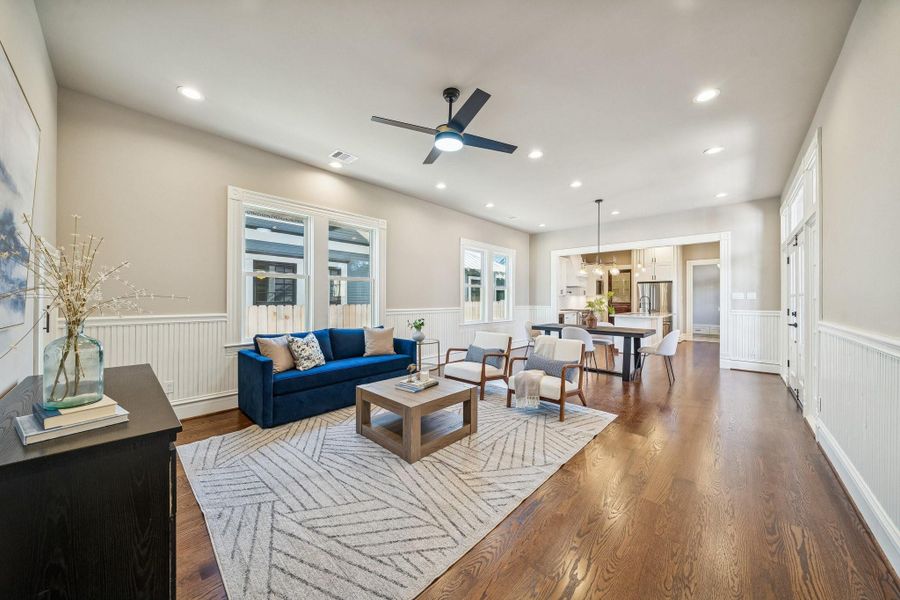 Open plan Living - Dining - Kitchen spaces! Note the wainscoting detail in this space. SOLID RED OAK hardwood floors throughout (no carpet in this home!). Plenty of windows letting in tons of natural light! Open plan Living - Dining - Kitchen spaces! Note the wainscoting detail in this space. SOLID RED OAK hardwood floors throughout (no carpet in this home!). Plenty of windows letting in tons of natural light!