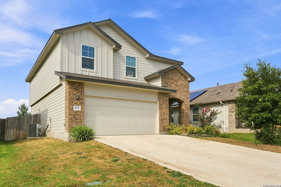 Front exterior of a new home in Redbird Ranch, San Antonio, TX, highlighting curb appeal (Image 2). Front exterior of a new home in Redbird Ranch, San Antonio, TX, highlighting curb appeal (Image 2).